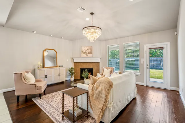 a living room with furniture fireplace and window