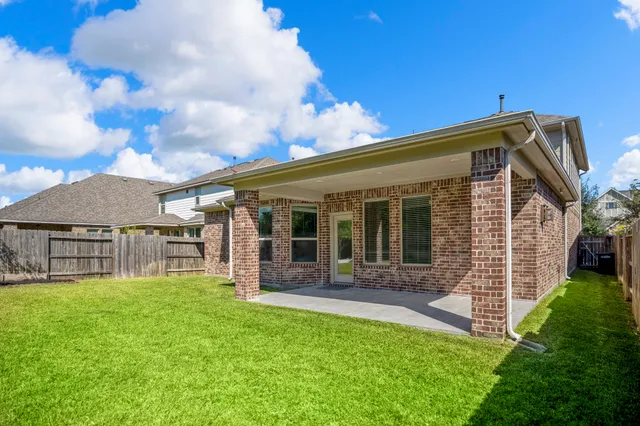 an aerial view of a garden with swimming pool