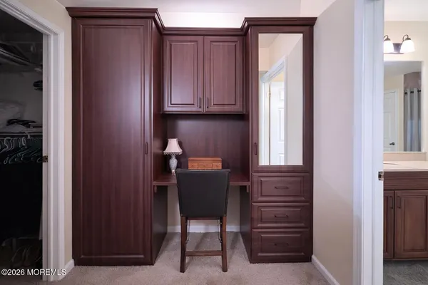 a room that has a chair and a closet