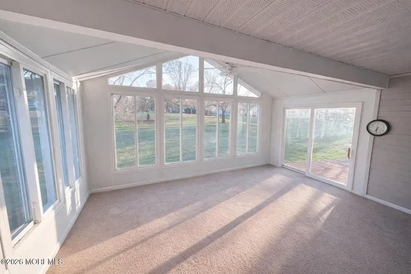 a view of empty room with floor to ceiling window