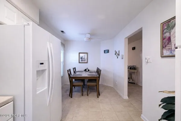 a view of a hallway with seating area