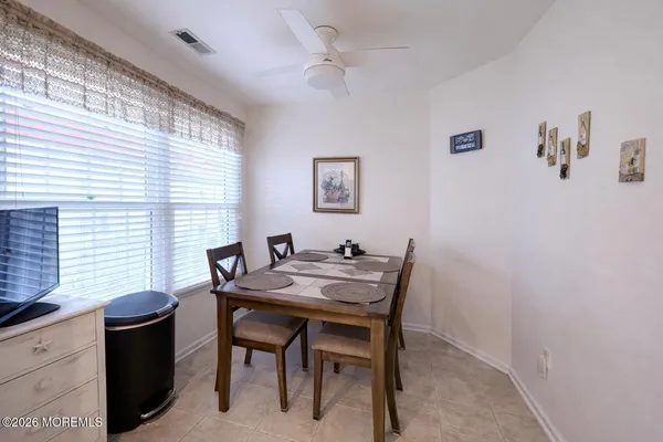 a view of a dining room with furniture