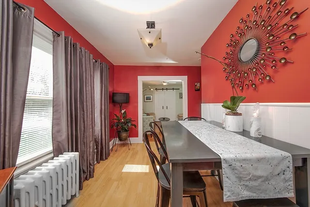 a dining room with furniture and window