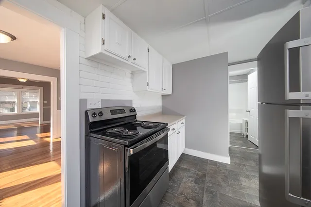 a kitchen with a stove and a refrigerator