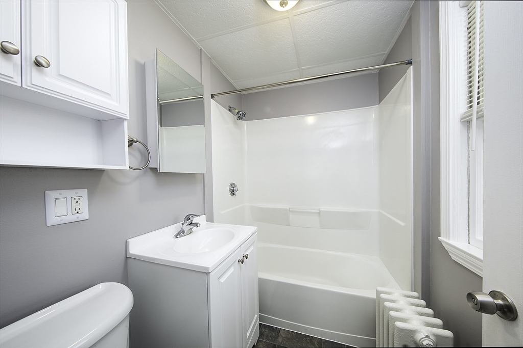 46 Winthrop Avenue Beverly, MA 01915 - Photo 16 of 29 a bathroom with a sink a toilet and shower