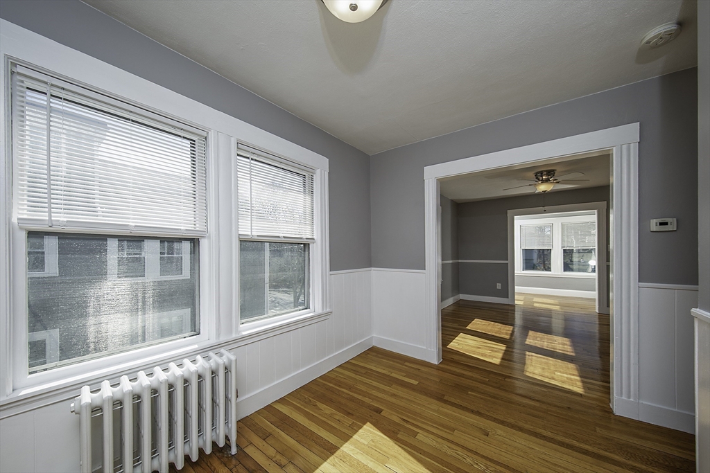 46 Winthrop Avenue Beverly, MA 01915 - Photo 18 of 29 a view of a livingroom with wooden floor and a window