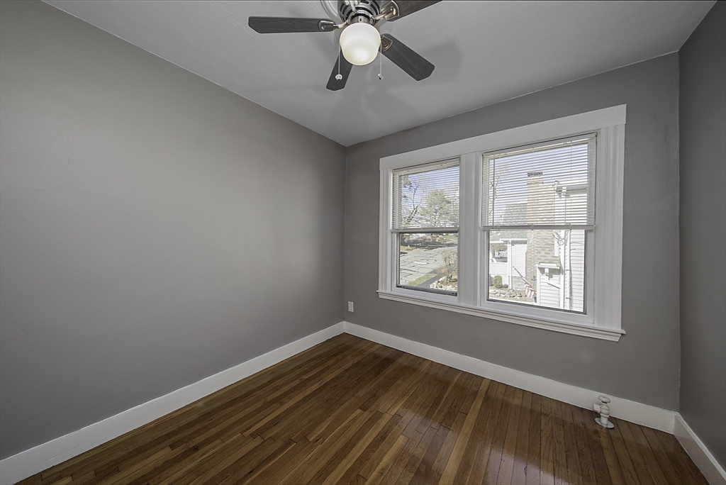 46 Winthrop Avenue Beverly, MA 01915 - Photo 19 of 29 a view of an empty room with wooden floor and a window