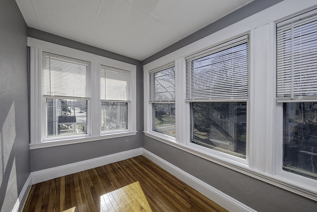 46 Winthrop Avenue Beverly, MA 01915 - Photo 20 of 29 a view of a livingroom with wooden floor and a window