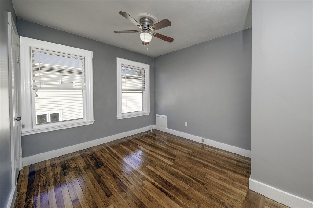 46 Winthrop Avenue Beverly, MA 01915 - Photo 21 of 29 wooden floor in an empty room with a window