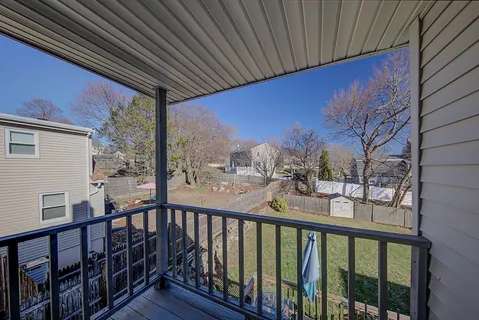 a view of a balcony with a street