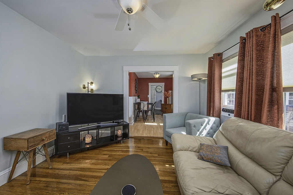 46 Winthrop Avenue Beverly, MA 01915 - Photo 9 of 29 a living room with furniture and a flat screen tv