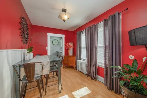 a view of a livingroom with furniture and a flat screen tv