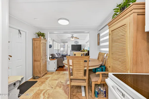 a view of a kitchen and dining room
