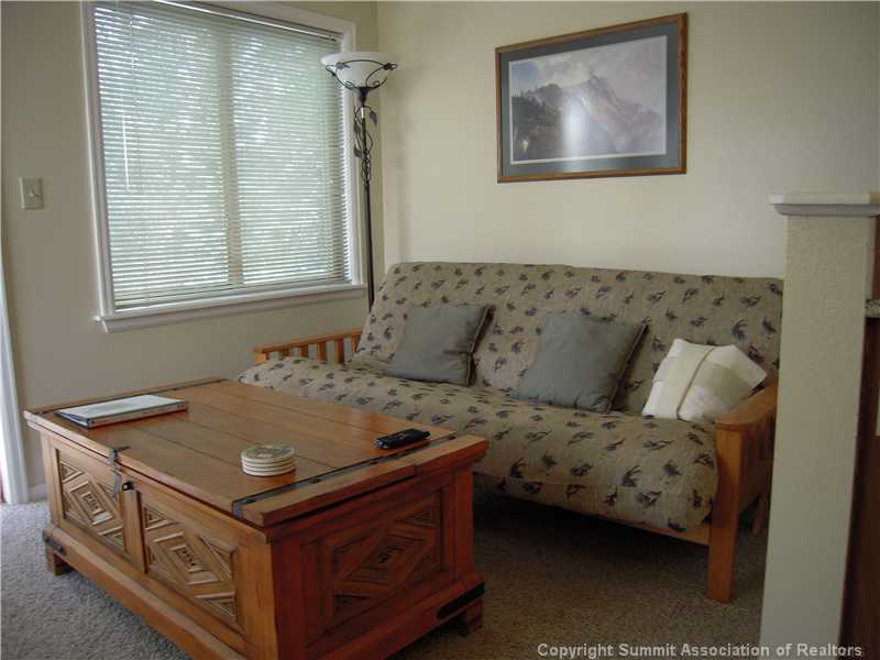 120 Sawmill Road, Unit 313 Breckenridge, CO 80424 - Photo 3 of 18 Living Room. Living room functions as a second sleeping space with storage in the cocktail table!