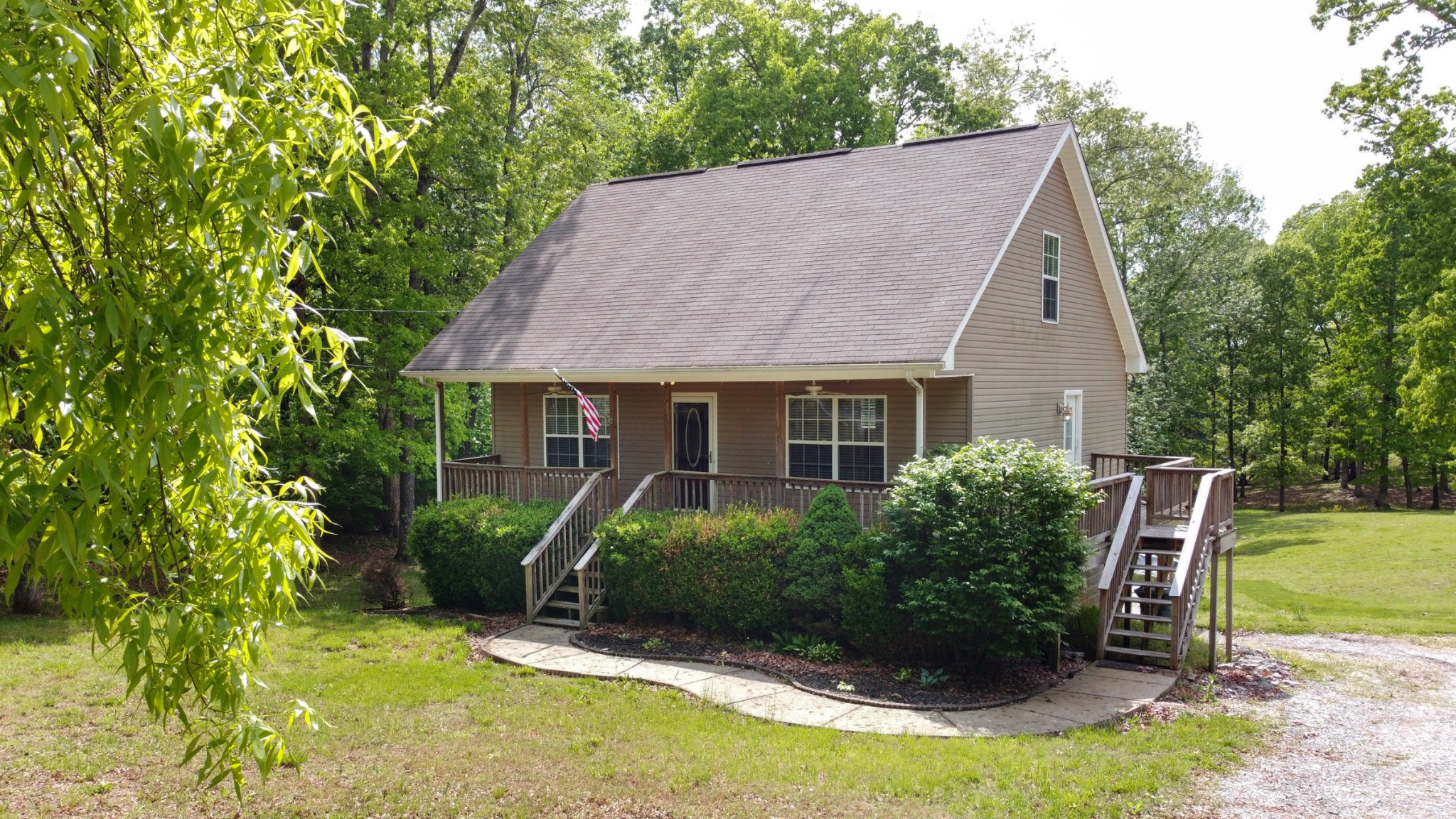 220 Black Road Dickson, TN 37055 - Photo 1 of 36 a view of a house with backyard and sitting area
