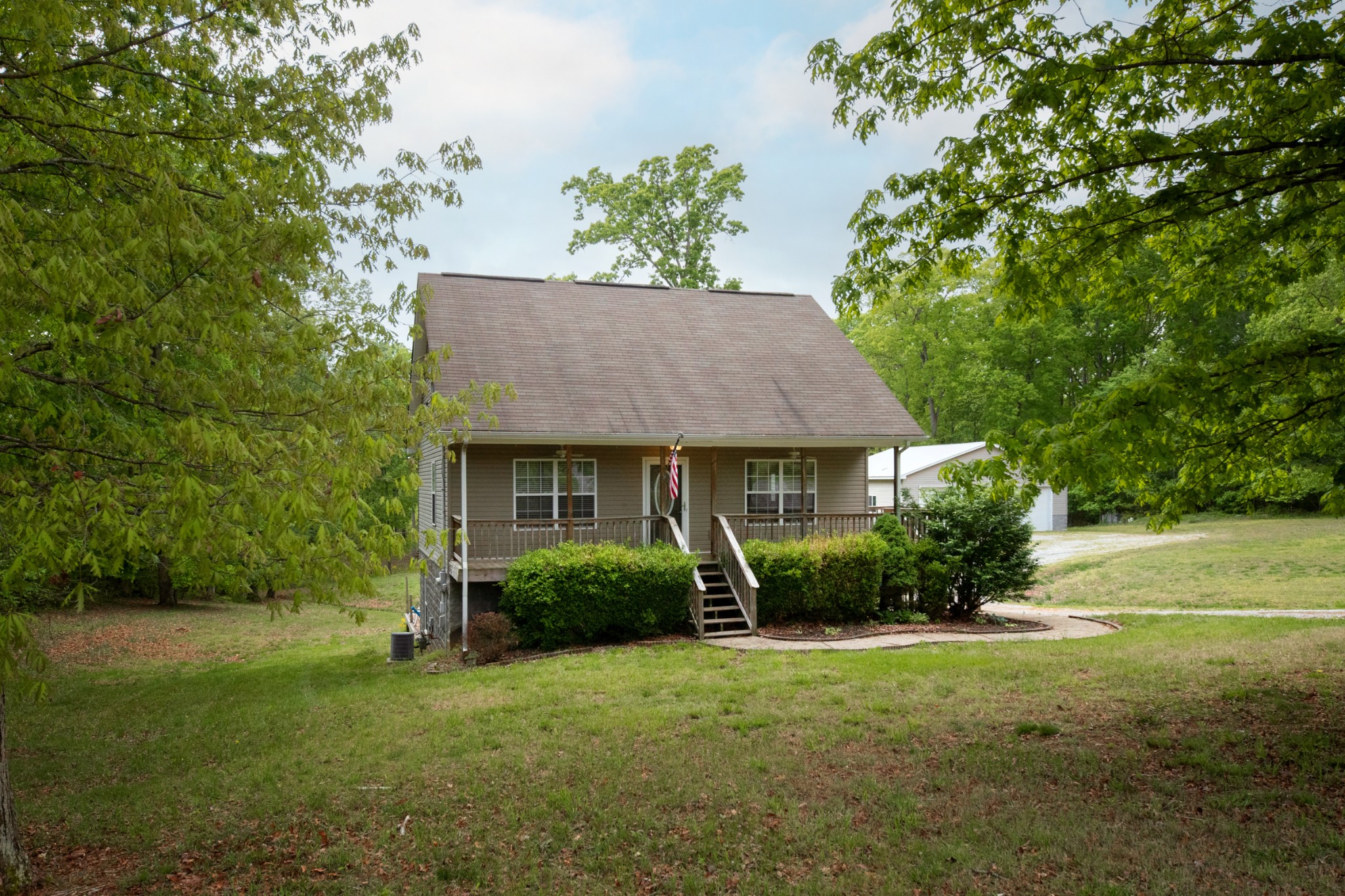 220 Black Road Dickson, TN 37055 - Photo 11 of 36 a view of a house with garden and yard