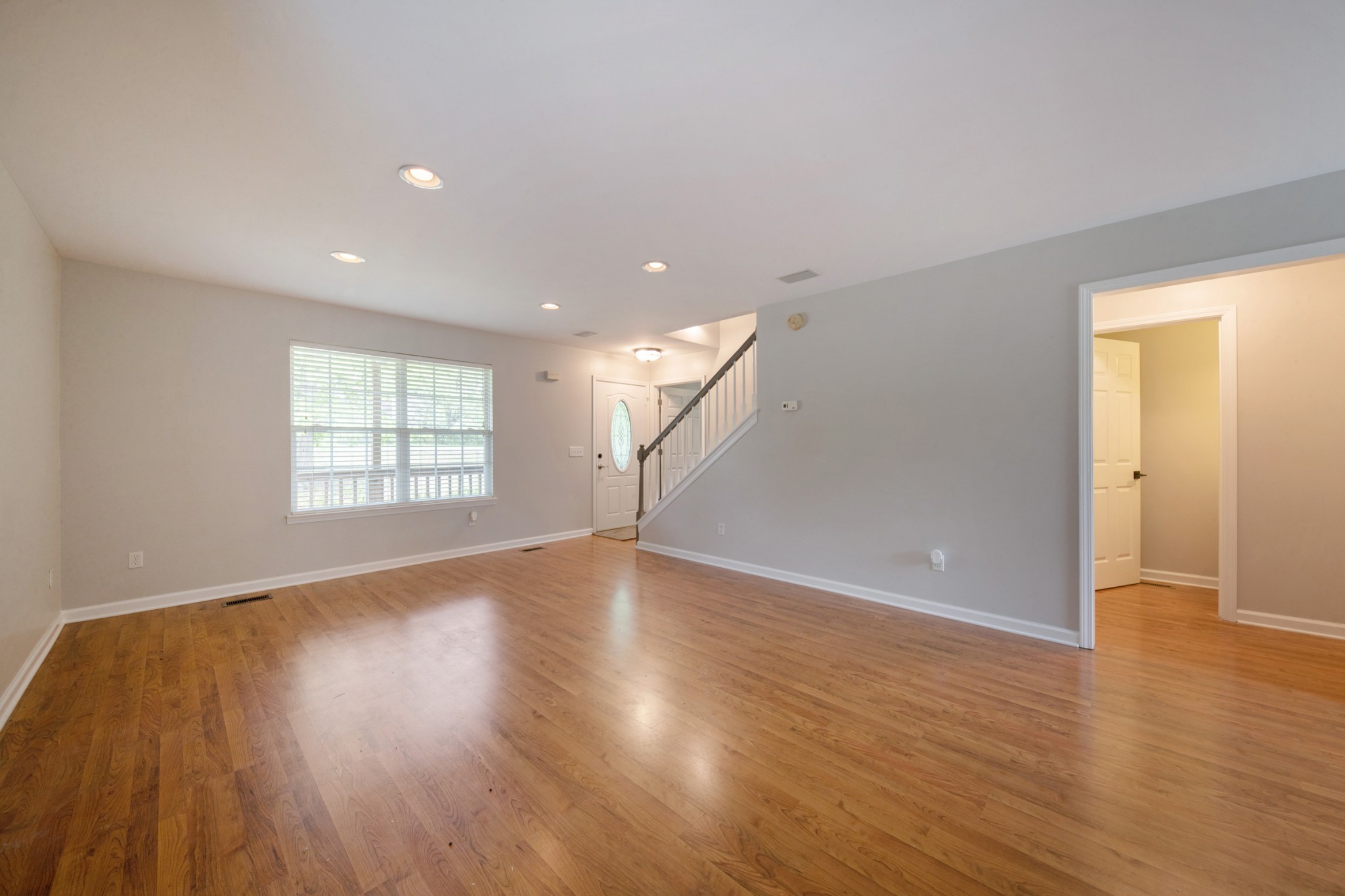 220 Black Road Dickson, TN 37055 - Photo 17 of 36 an empty room with wooden floor and windows