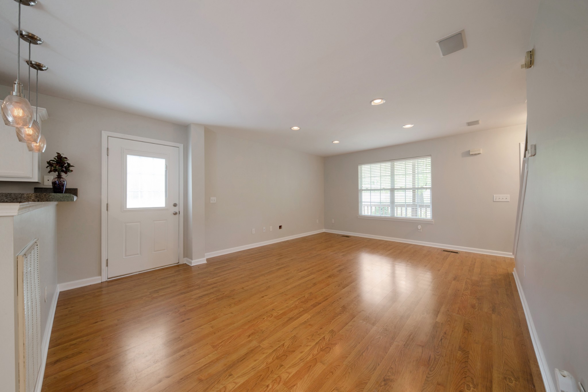 220 Black Road Dickson, TN 37055 - Photo 18 of 36 an empty room with wooden floor and windows