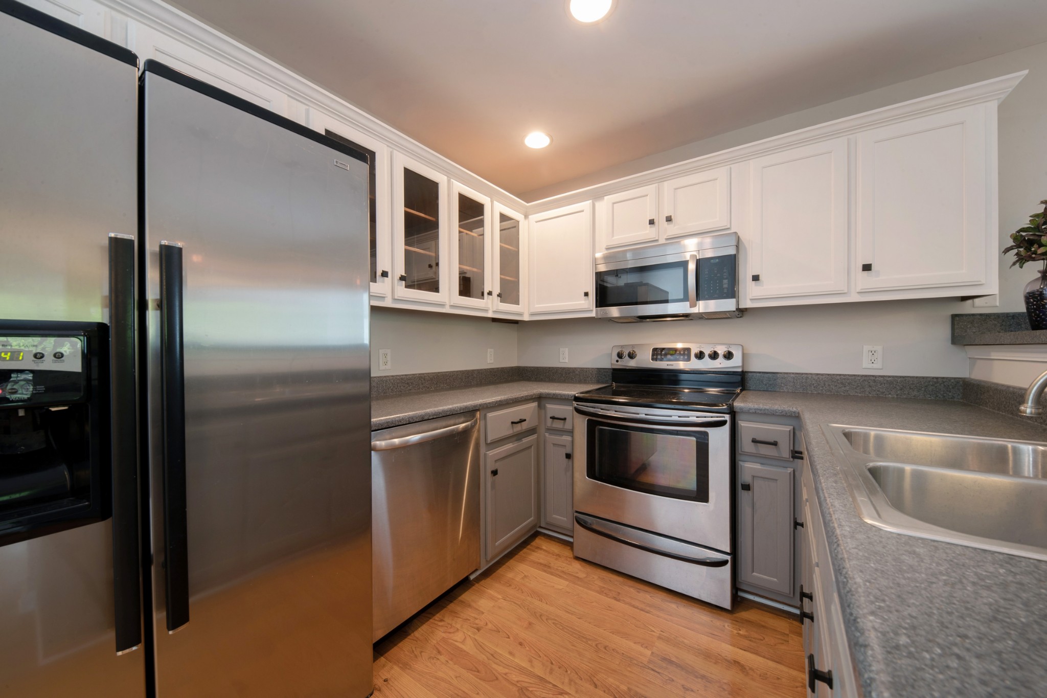 220 Black Road Dickson, TN 37055 - Photo 22 of 36 a kitchen with stainless steel appliances granite countertop a refrigerator and a stove