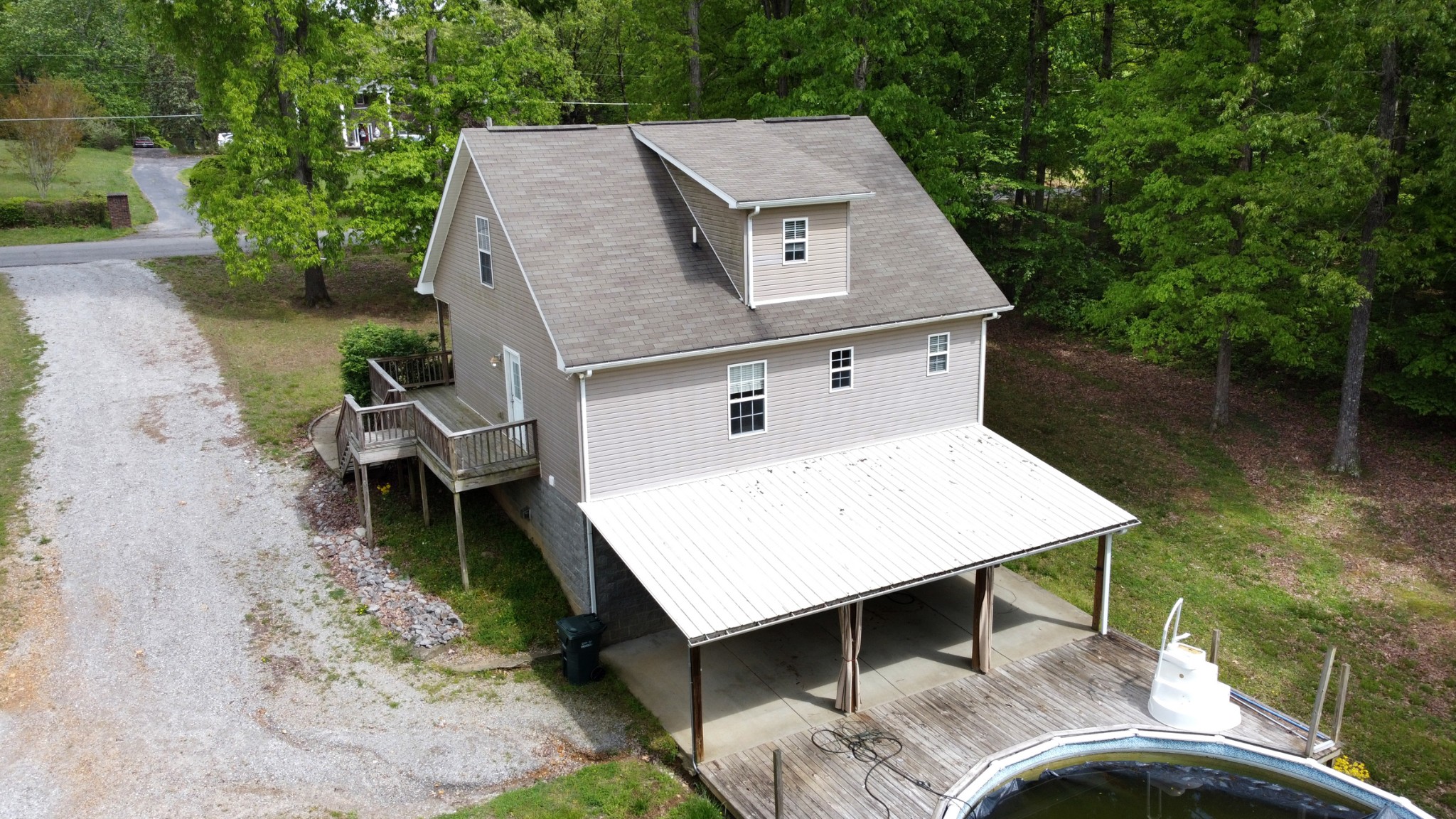 220 Black Road Dickson, TN 37055 - Photo 7 of 36 an aerial view of a house with swimming pool and large trees