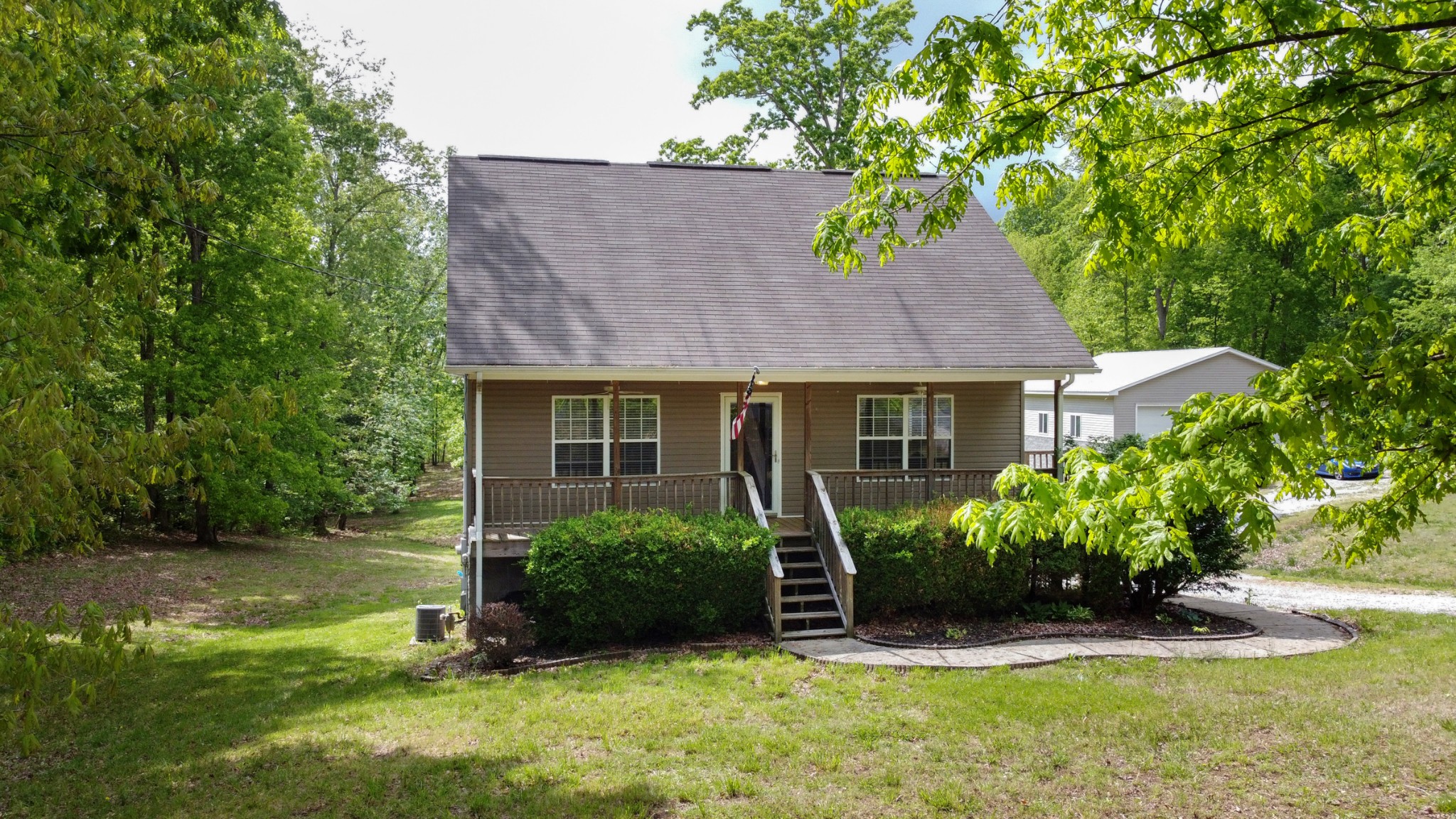 220 Black Road Dickson, TN 37055 - Photo 8 of 36 a view of a house with backyard garden and swimming pool