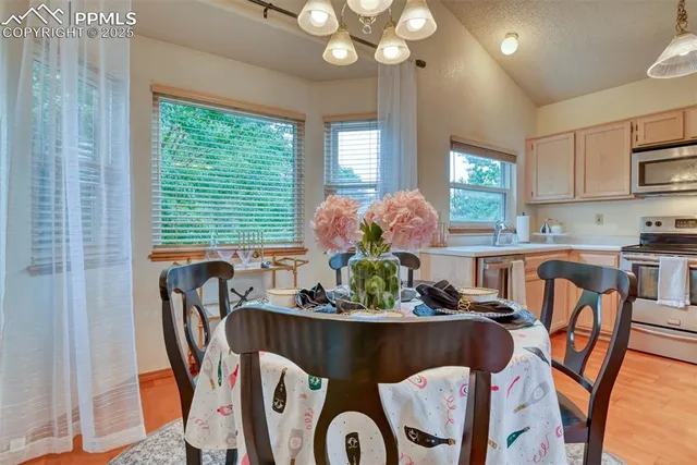 a dining room with furniture and window