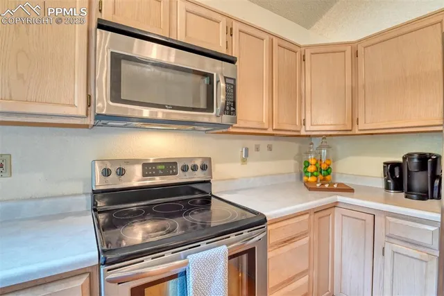 a kitchen with a stove and a microwave