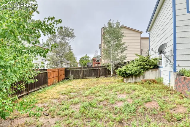 a view of a backyard of the house