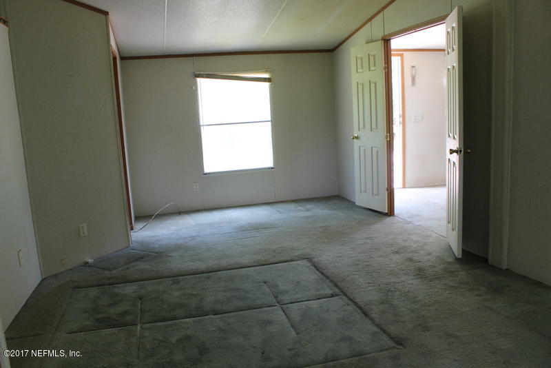 15577 Flounder Road Jacksonville, FL 32226 - Photo 17 of 35 a view of an empty room with a window