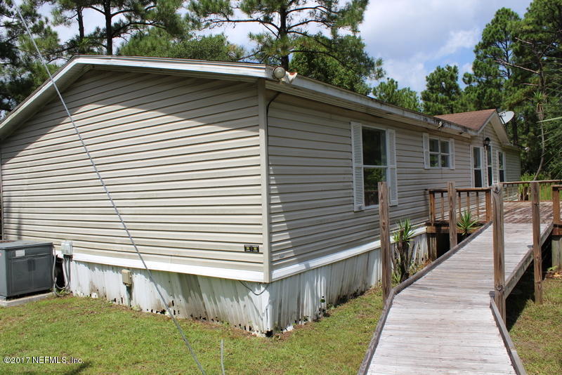 15577 Flounder Road Jacksonville, FL 32226 - Photo 3 of 35 a view of a house with a yard
