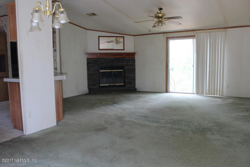 15577 Flounder Road Jacksonville, FL 32226 - Photo 8 of 35 a view of empty room with a fireplace