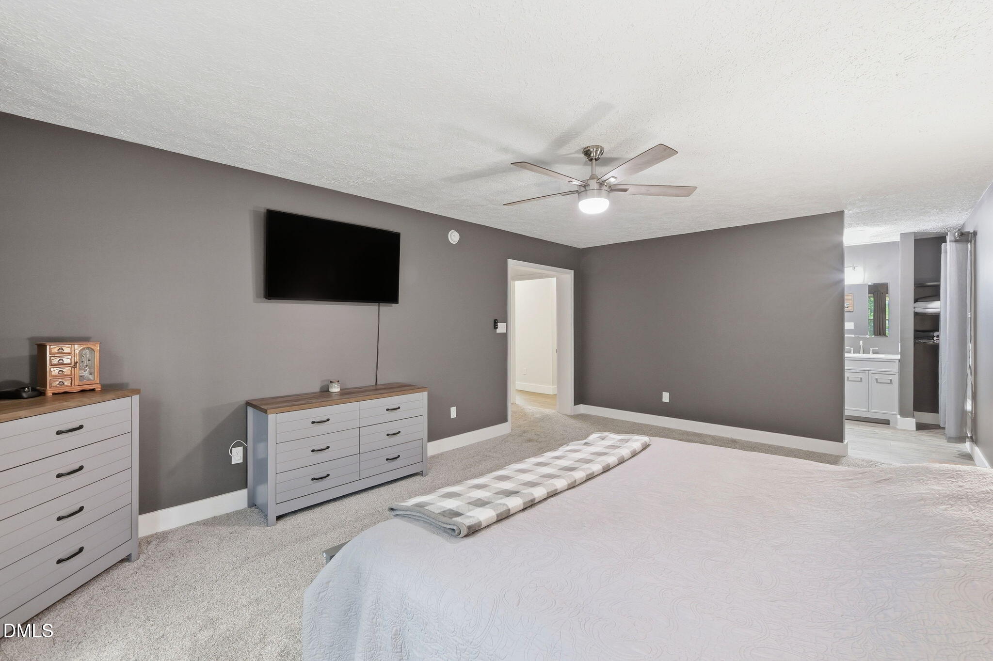 1925 Old Allensville Road Roxboro, NC 27574 - Photo 51 of 58 a bedroom with a bed and a flat screen tv