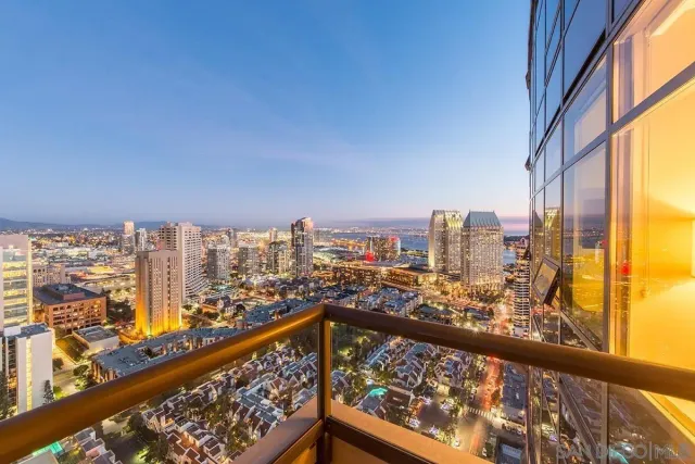 a view of a city skyline from a balcony