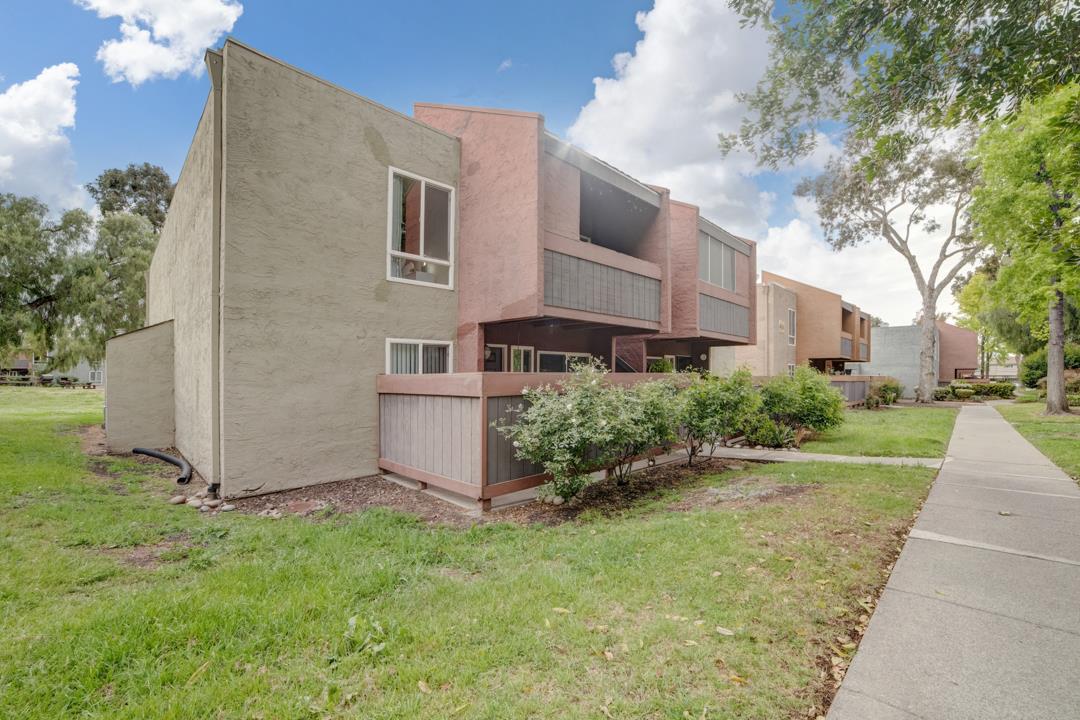 452 Dempsey Road, Unit 253 Milpitas, CA 95035 - Photo 2 of 26 a view of backyard with potted plants and large tree