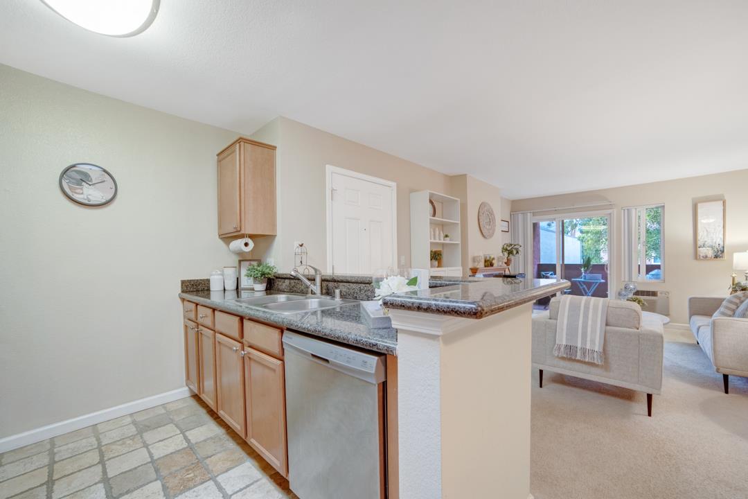 452 Dempsey Road, Unit 253 Milpitas, CA 95035 - Photo 7 of 26 a view of a kitchen area with furniture and wooden floor