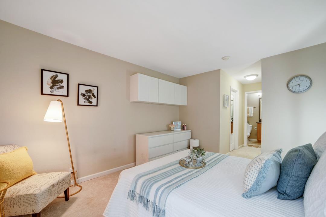 452 Dempsey Road, Unit 253 Milpitas, CA 95035 - Photo 9 of 26 a bedroom with a bed and a couch