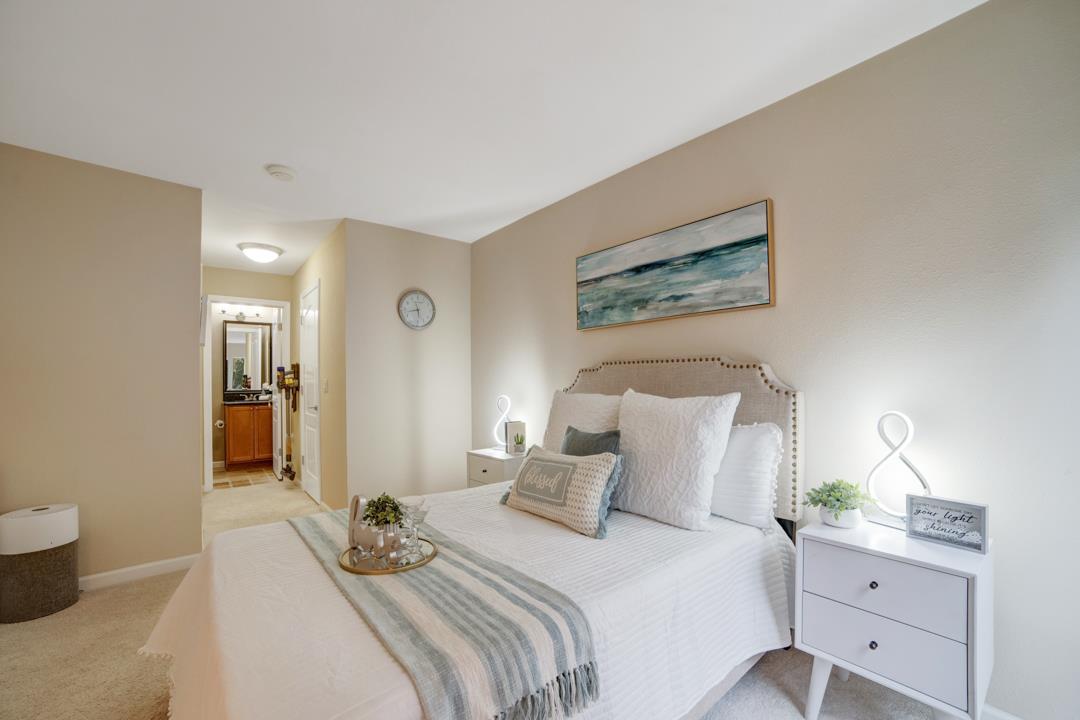 452 Dempsey Road, Unit 253 Milpitas, CA 95035 - Photo 10 of 26 a bedroom with a bed and a painting on the wall