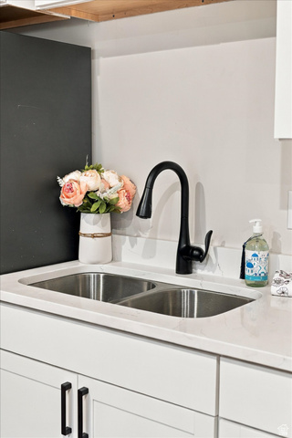 754 West 400 North Mapleton, UT 84664 - Photo 59 of 86 Double-basin stainless steel sink with a matte black faucet, set into a light-toned countertop.