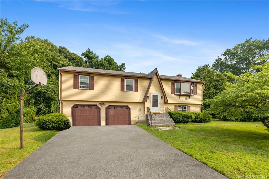 101 Abbe Road Windsor, CT 06095 - Photo 1 of 1 a front view of a house with garden