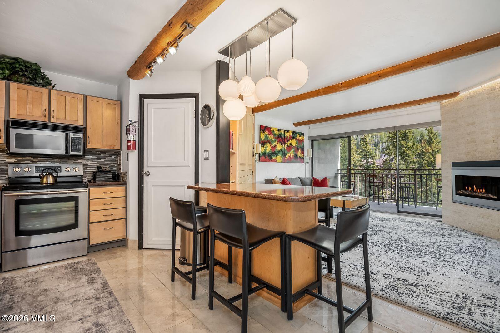 500 South Frontage Road East, Unit 308 Vail, CO 81657 - Photo 7 of 25 a view of a dining room with furniture window and outside view