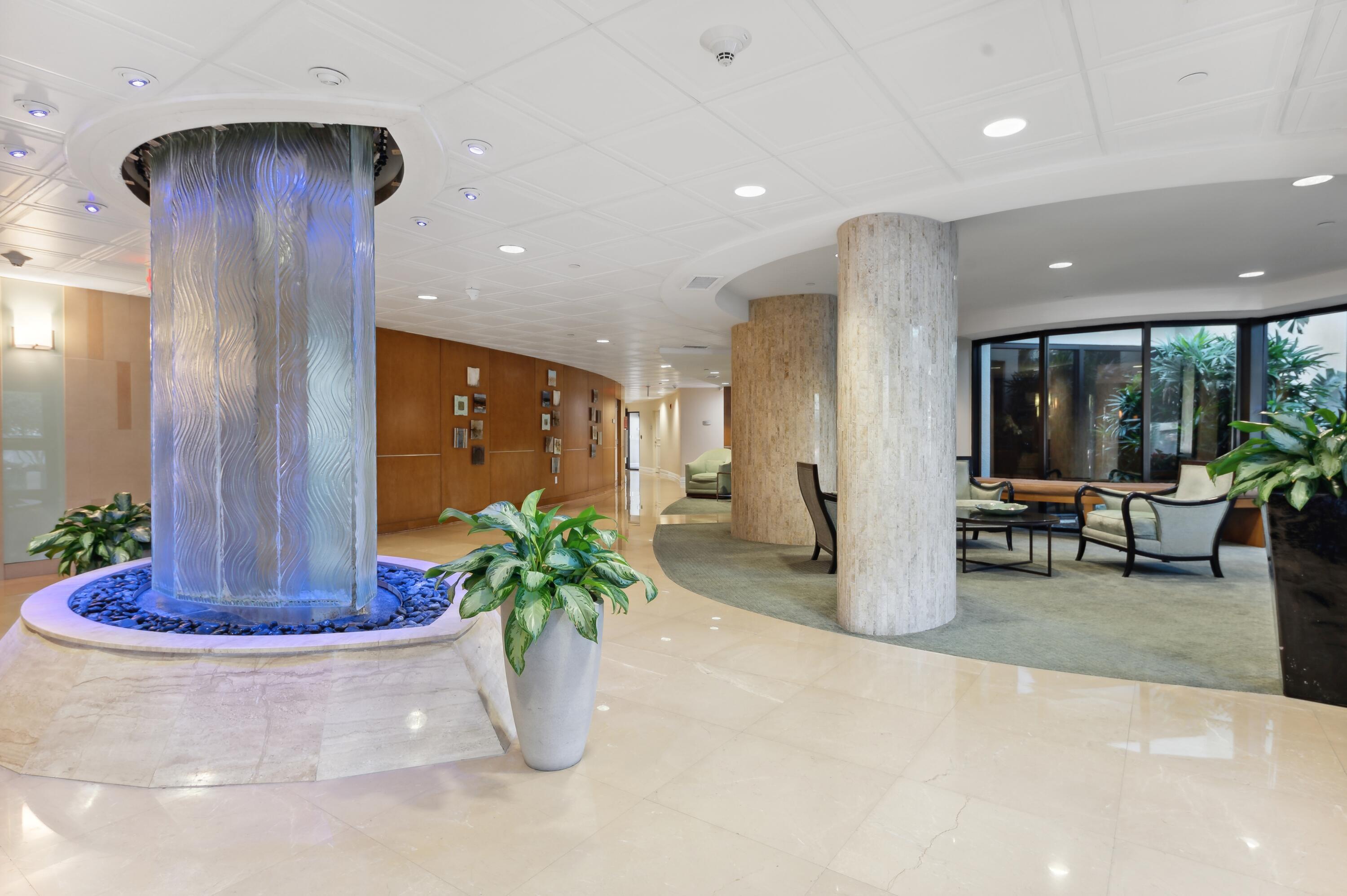 3000 North Ocean Drive, Unit 18G Singer Island, FL 33404 - Photo 17 of 46 a view of a lobby with chair and potted plant
