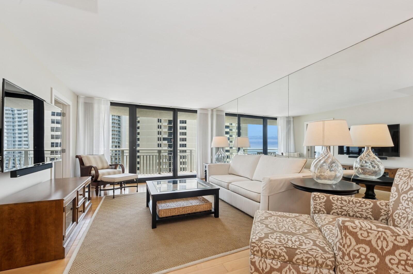 3000 North Ocean Drive, Unit 18G Singer Island, FL 33404 - Photo 2 of 46 a living room with furniture and a large window