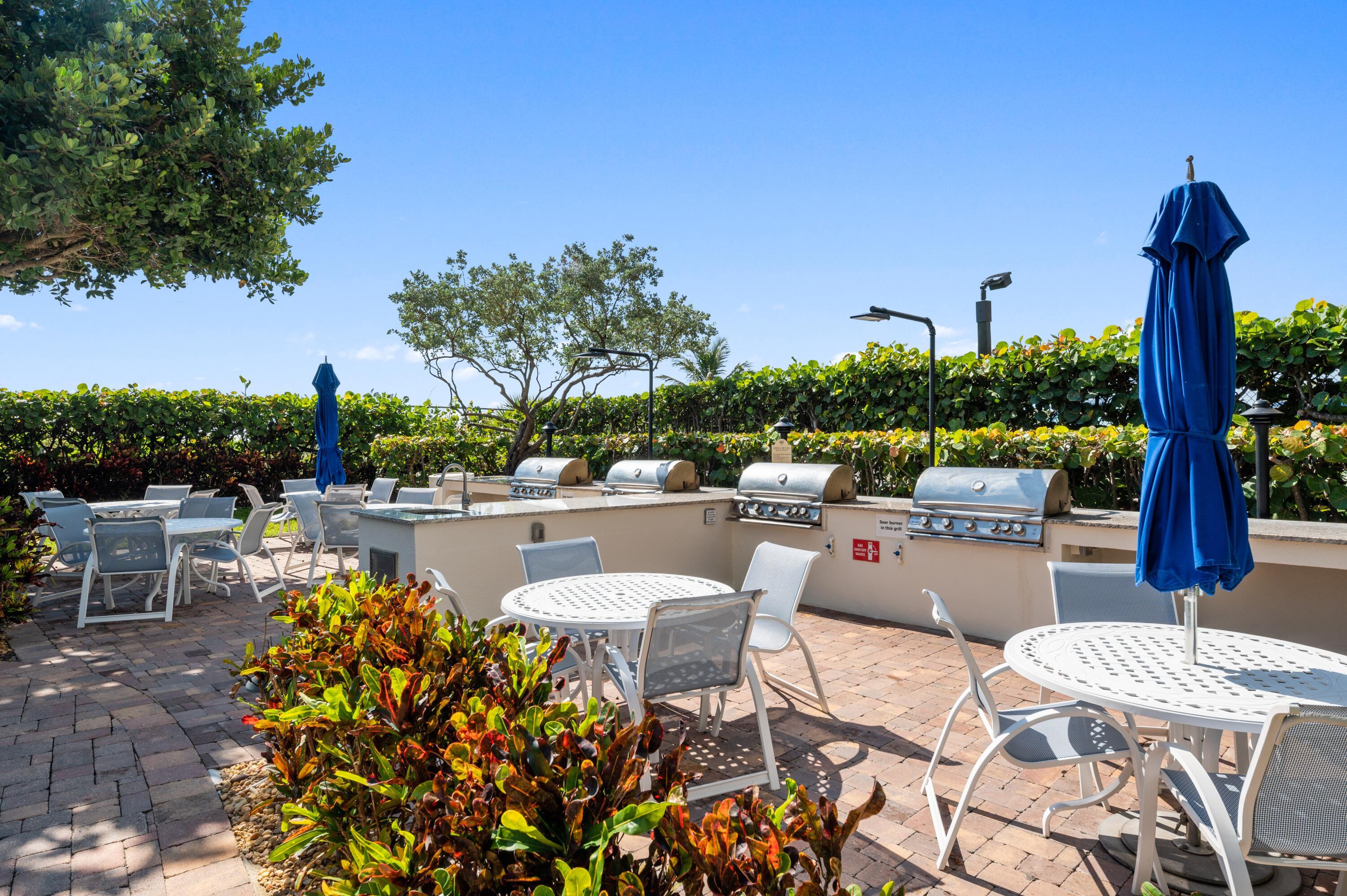 3000 North Ocean Drive, Unit 18G Singer Island, FL 33404 - Photo 30 of 46 a swimming pool with outdoor seating and plants