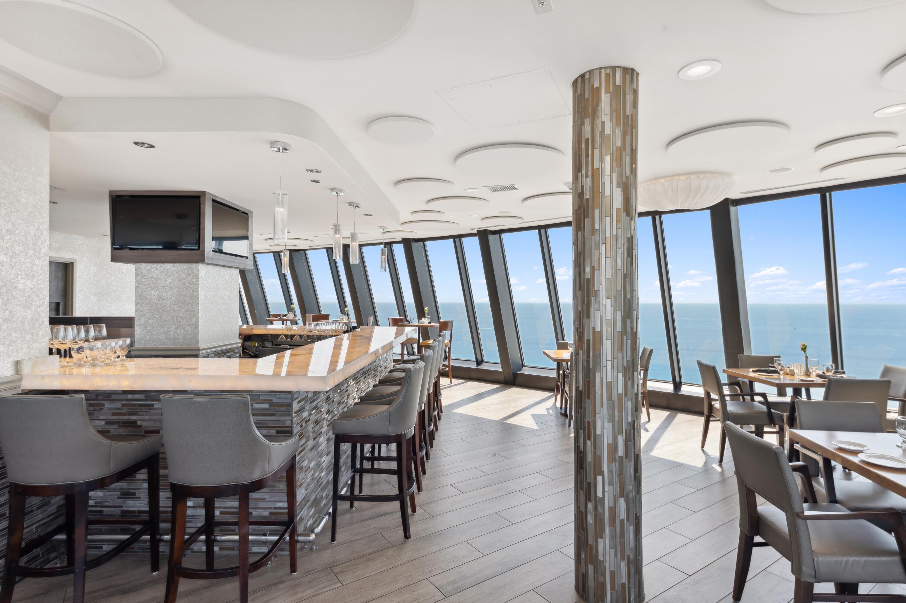 3000 North Ocean Drive, Unit 18G Singer Island, FL 33404 - Photo 41 of 46 a dining room with furniture and wooden floor