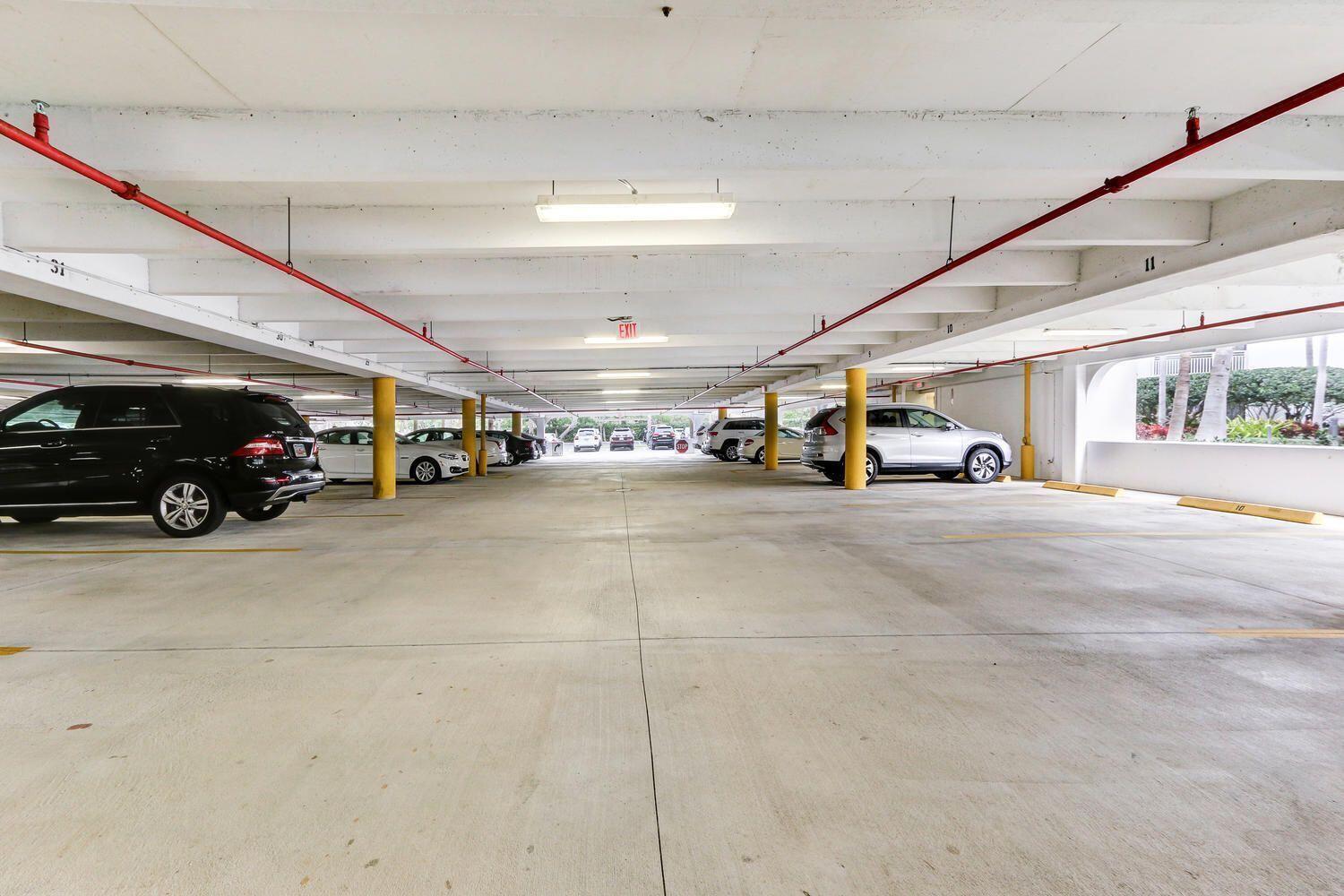 3000 North Ocean Drive, Unit 18G Singer Island, FL 33404 - Photo 45 of 46 a view of parking area with cars parked
