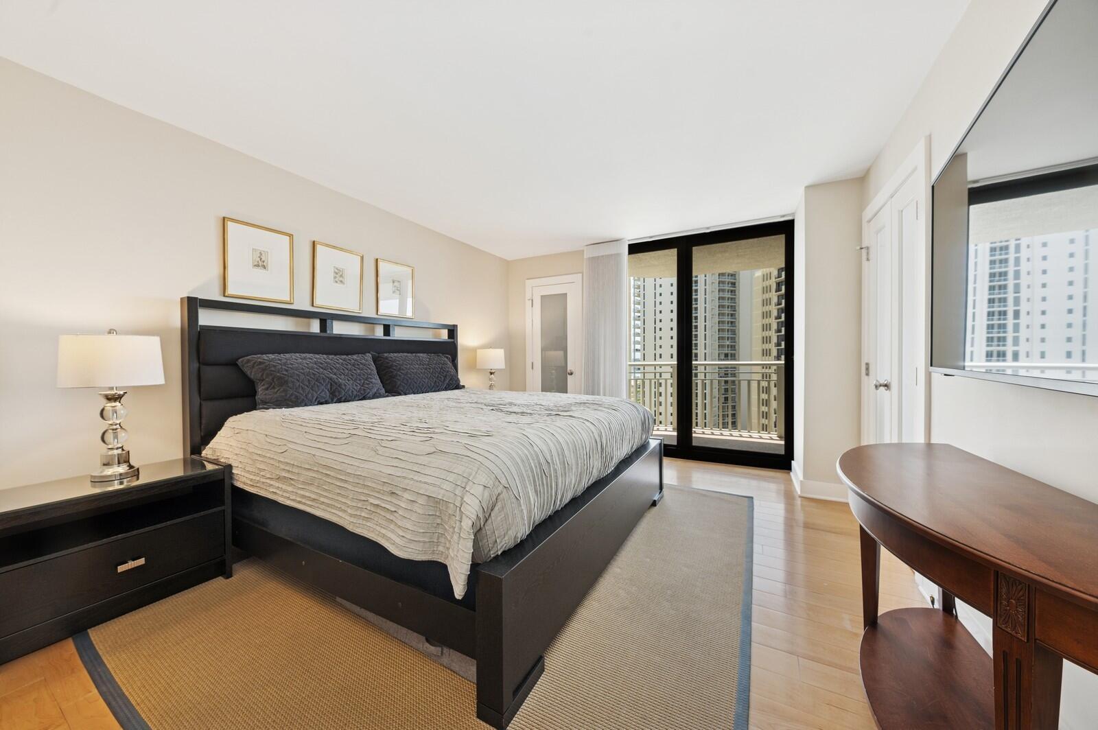 3000 North Ocean Drive, Unit 18G Singer Island, FL 33404 - Photo 6 of 46 a bedroom with a bed and window