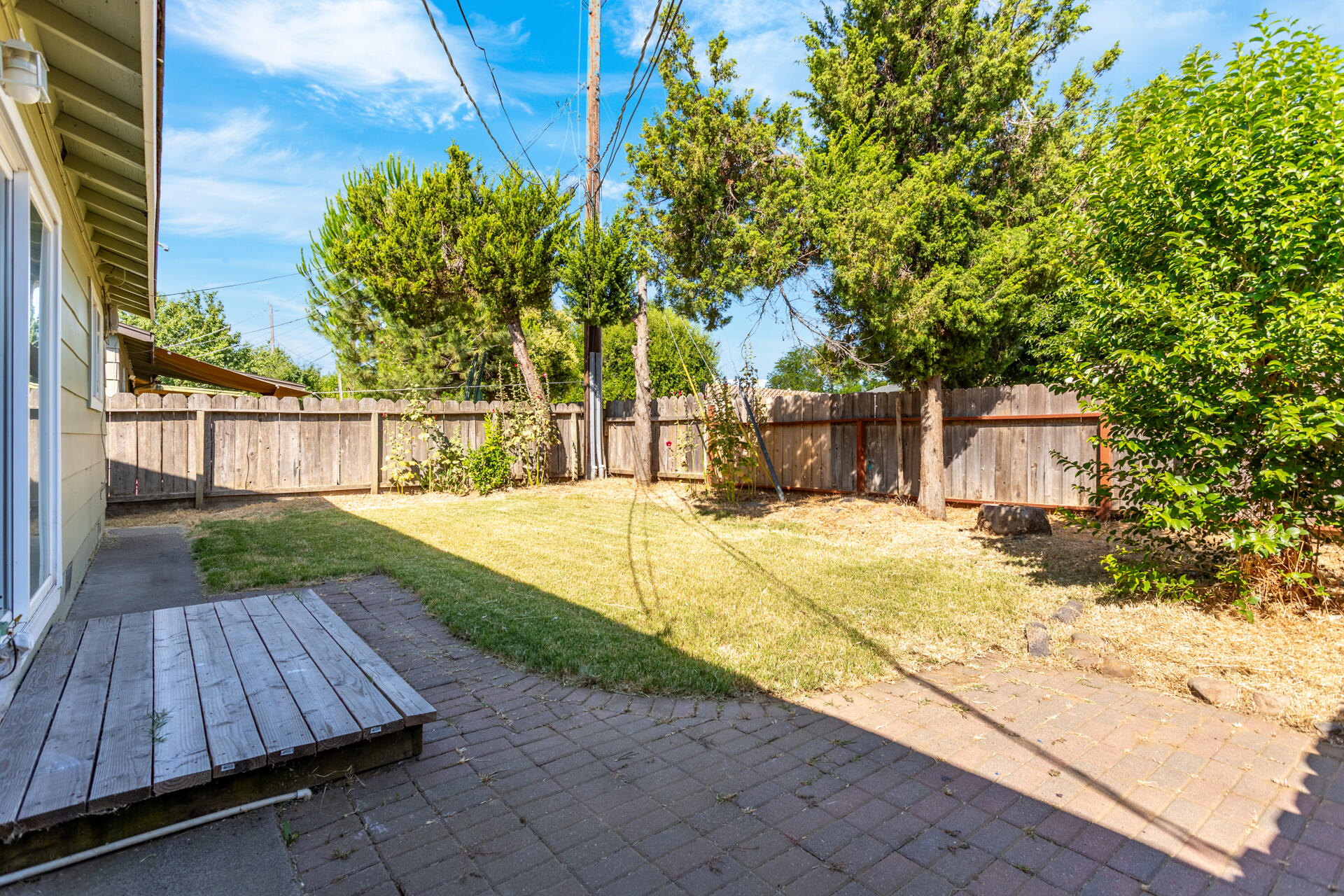 3252 Daisy Street Anderson, CA 96007 - Photo 19 of 20 a view of backyard with a garden and trees