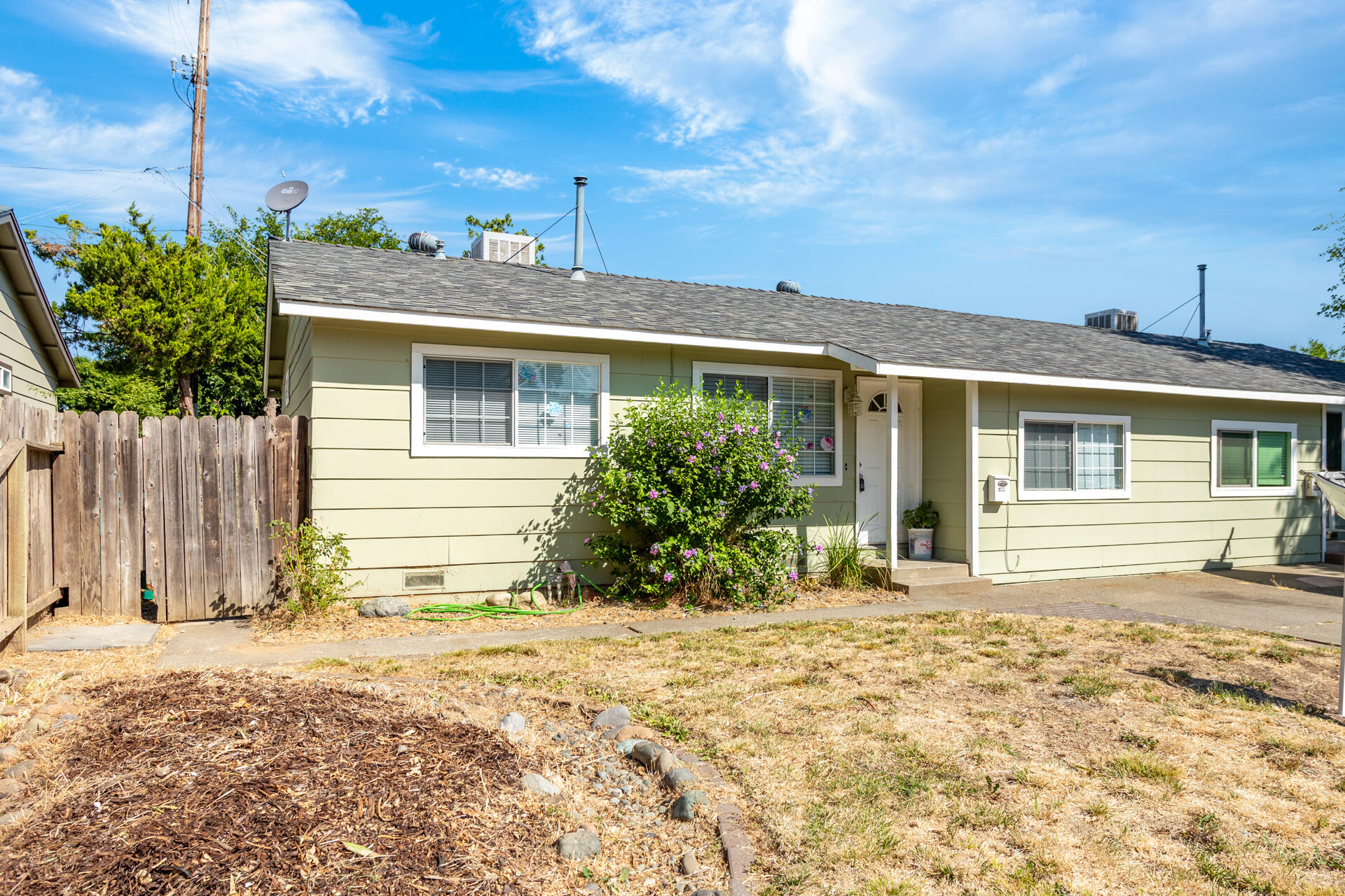 3252 Daisy Street Anderson, CA 96007 - Photo 2 of 20 a front view of a house with a yard