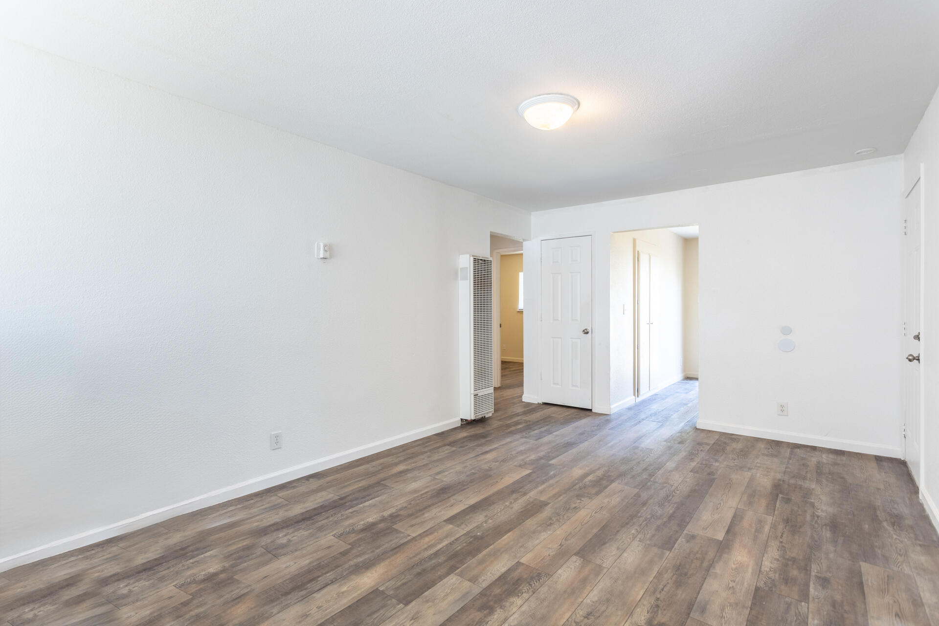 3252 Daisy Street Anderson, CA 96007 - Photo 6 of 20 a view of an empty room with wooden floor
