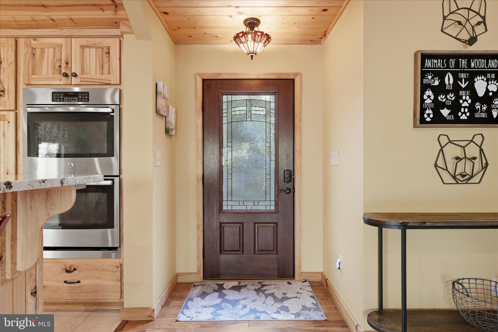 1856 Crossings View Road Paw Paw, WV 25434 - Photo 5 of 45 a view of a hallway with a dining table and chairs